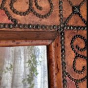 Antique mirror designed by "Pierre Lottier". Leather and nails. France 1