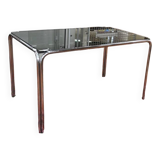 Vintage glass dining table with chrome legs.