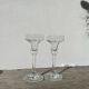 Pair of clear glass candlesticks, signed