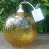 A vintage 70s blown glass pendant light with gold glitter in a globe shape