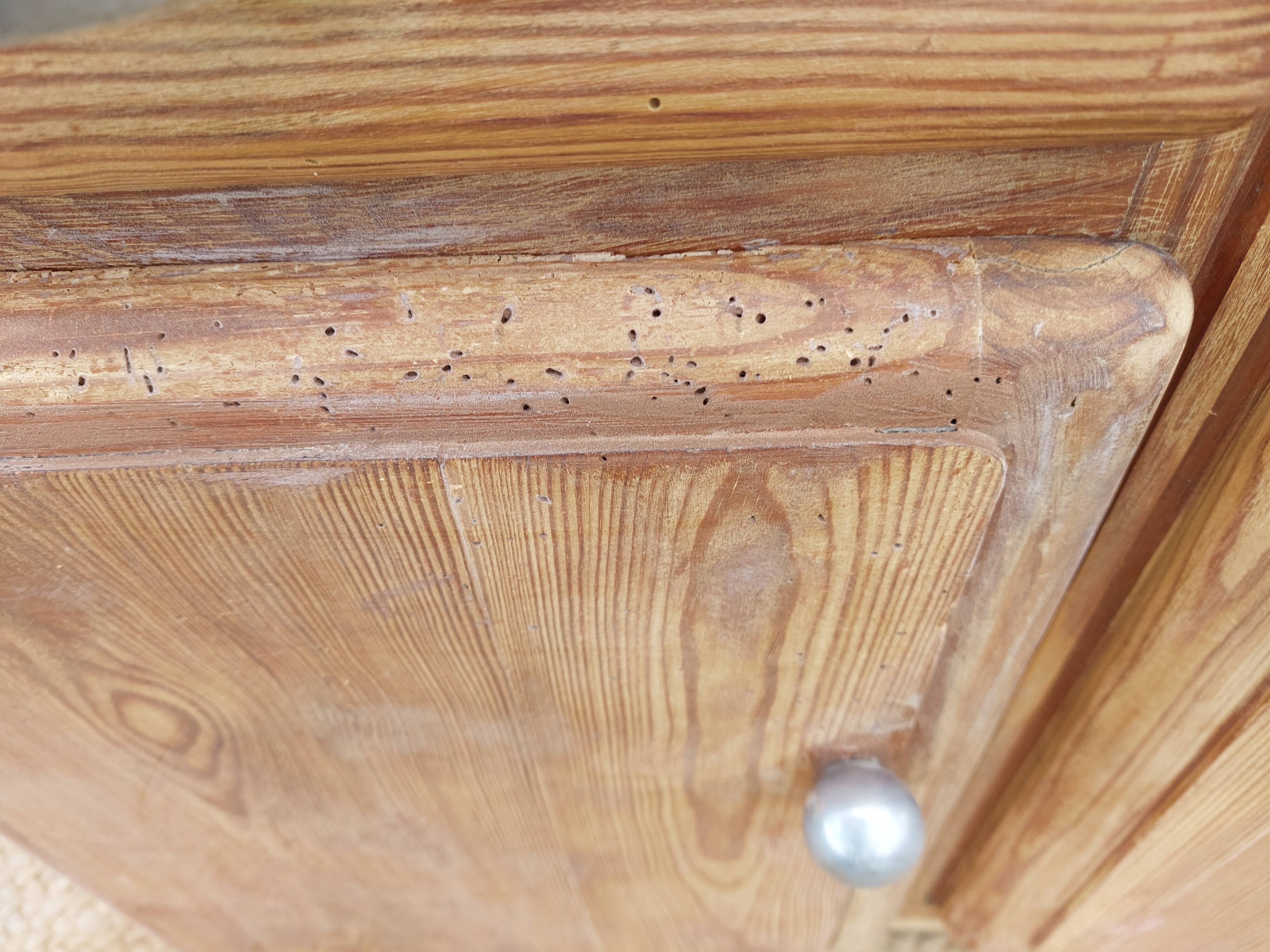 Vintage wooden buffet with a marble top.
