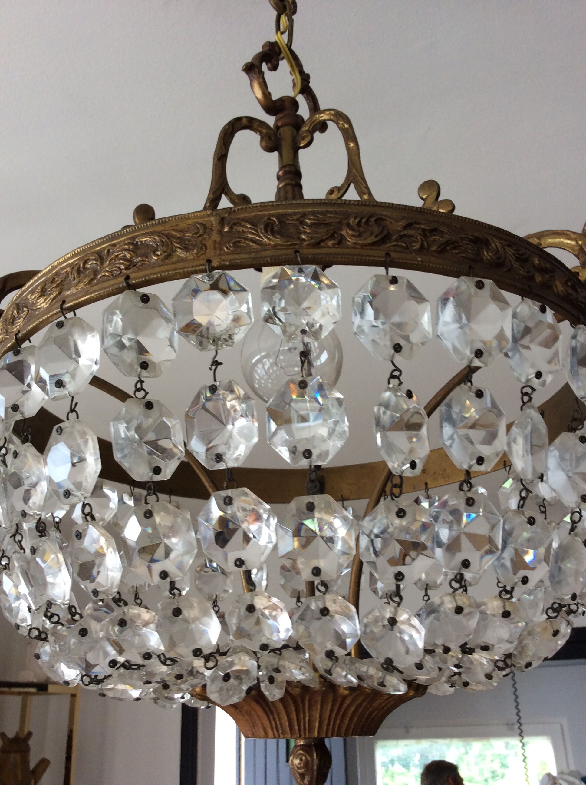 Old chandelier with bronze stamps