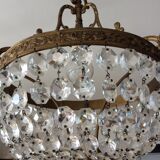 Old chandelier with bronze stamps