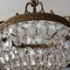 Old chandelier with bronze stamps