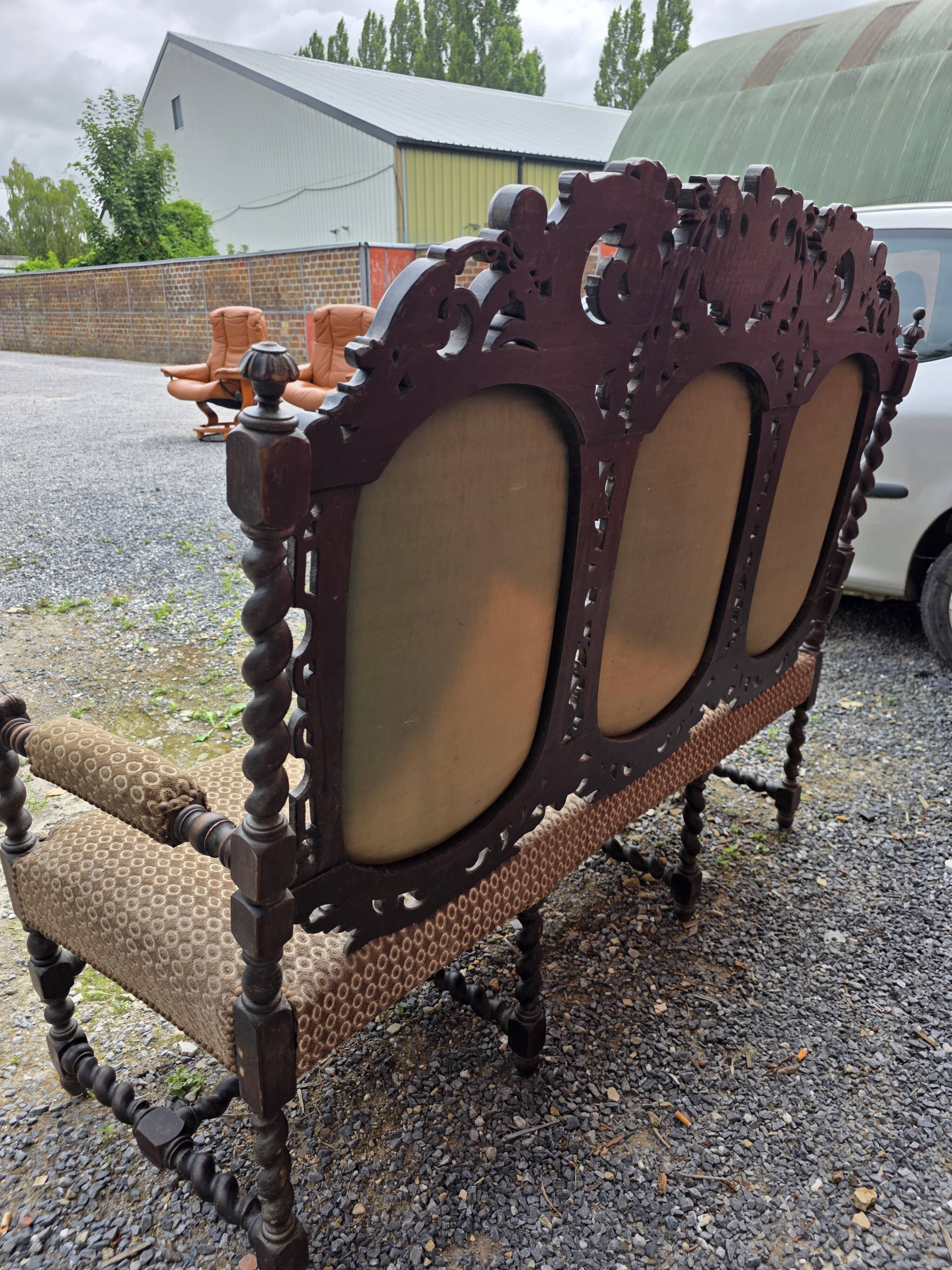 Three-seater armchair in Louis XIII style made of oak from the 19th century.