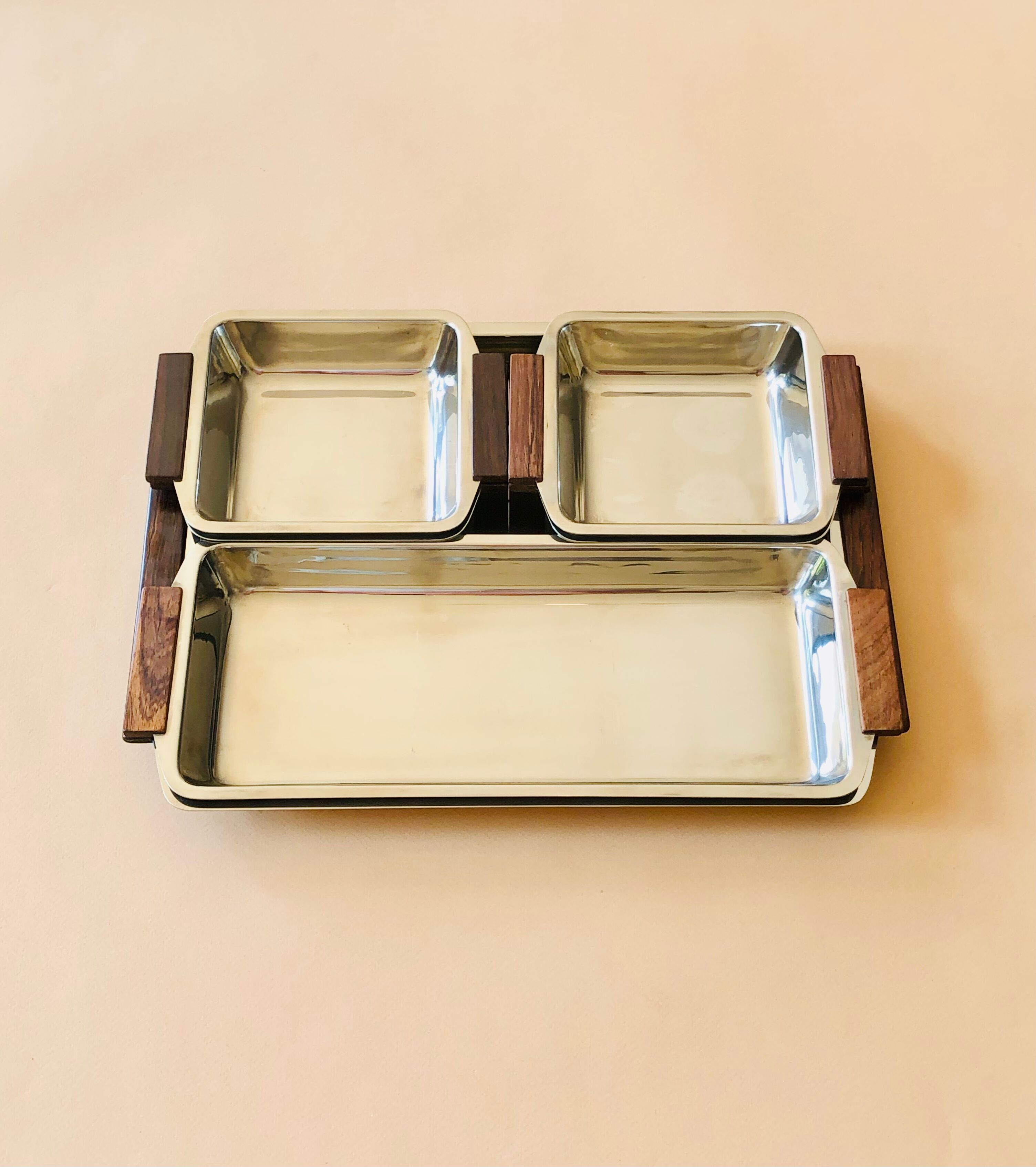 Service of Scandinavian dishes in stainless steel and teak 1970