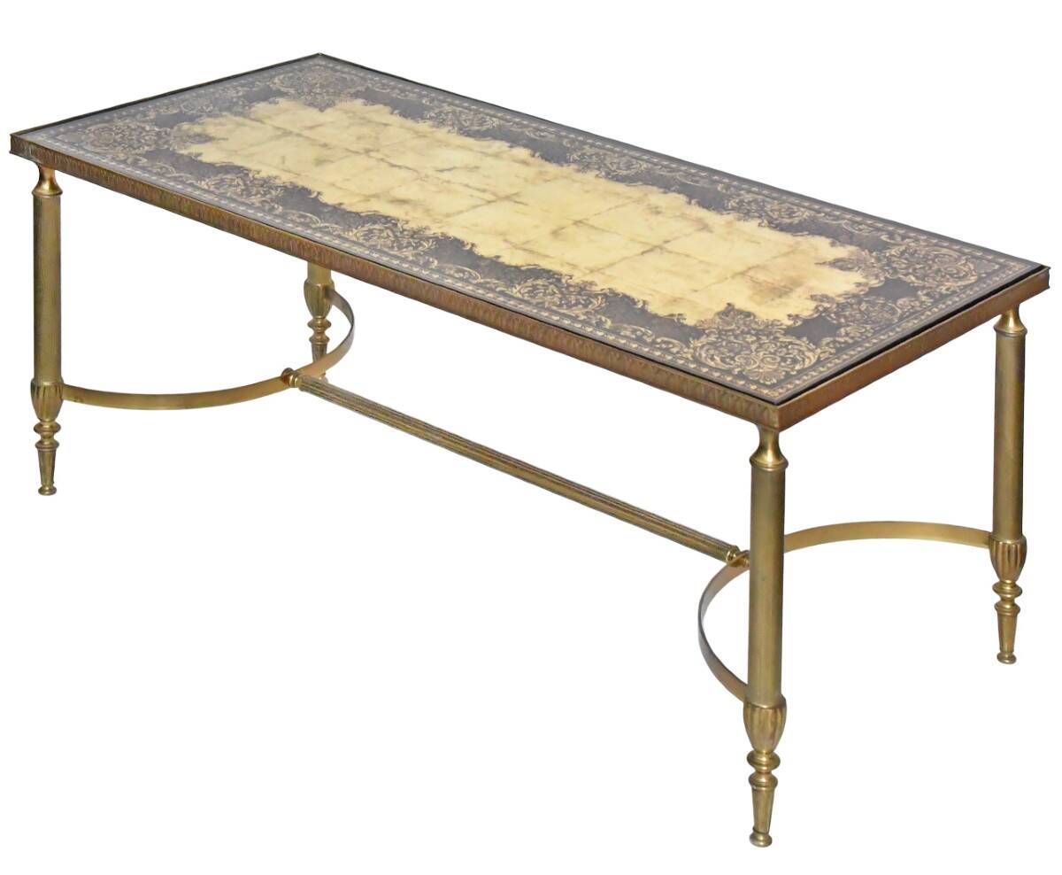 Coffee table in gilded brass with a mirrored eglomisé glass top.