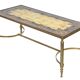 Coffee table in gilded brass with a mirrored eglomisé glass top.