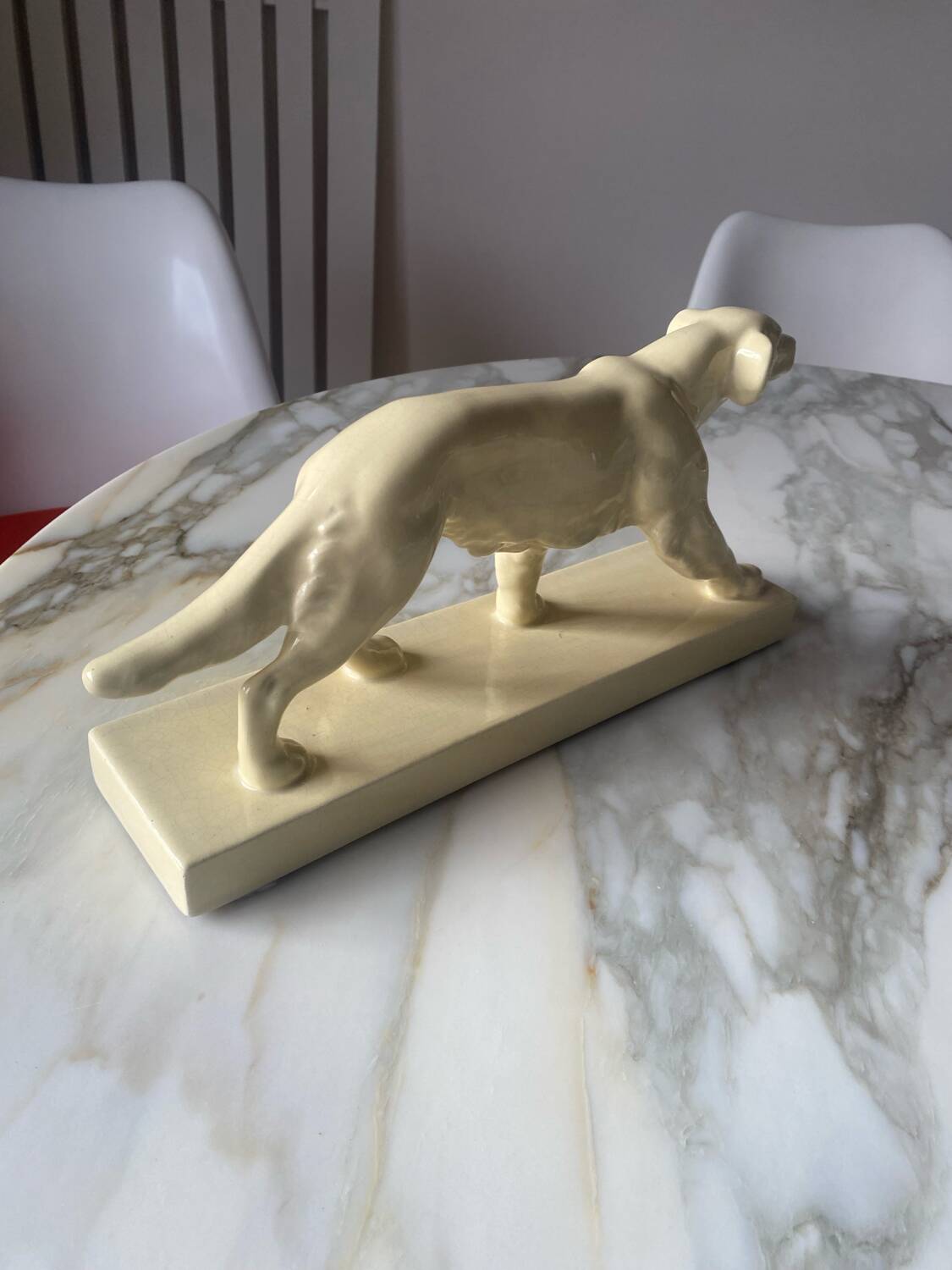 Ceramic of a walking dog brand Odyv