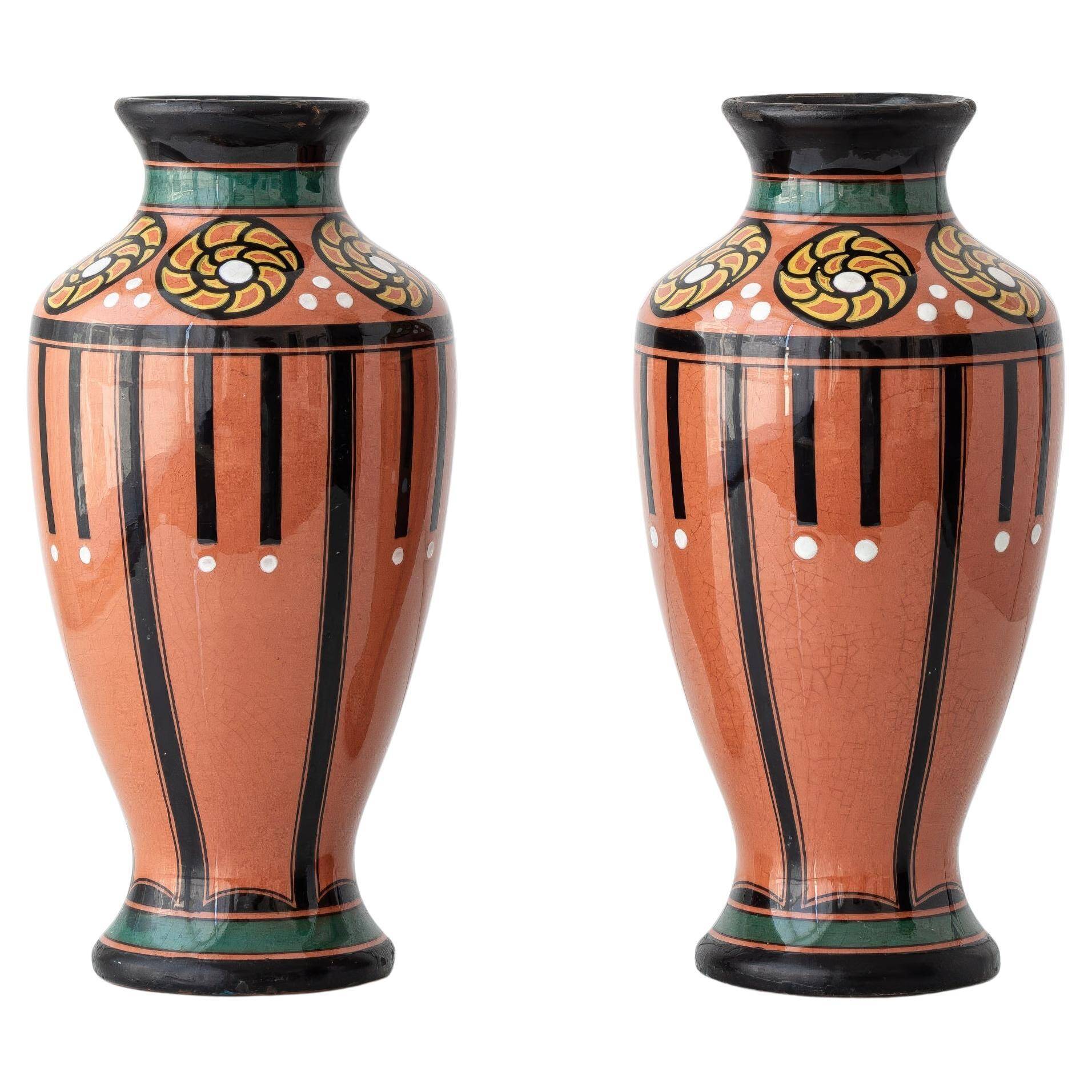 Pair of Dutch Art Deco vases, hand-painted Gouda-style ceramic with bold glazing.