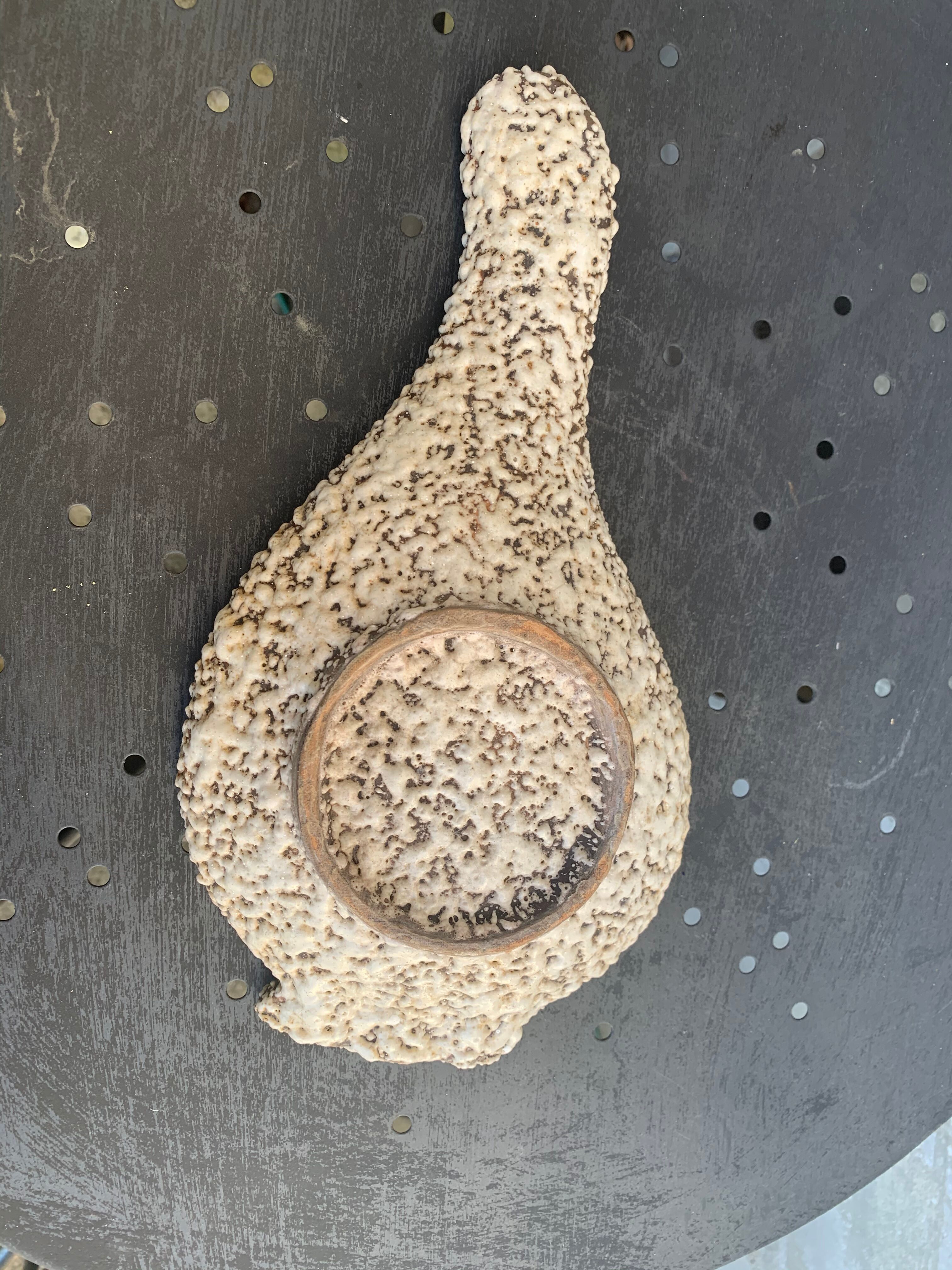 Glassed ceramic cut enamelled prehistoric warrior motif vintage red 1950