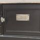 Low TV cabinet with black patina, twelve drawers and one door