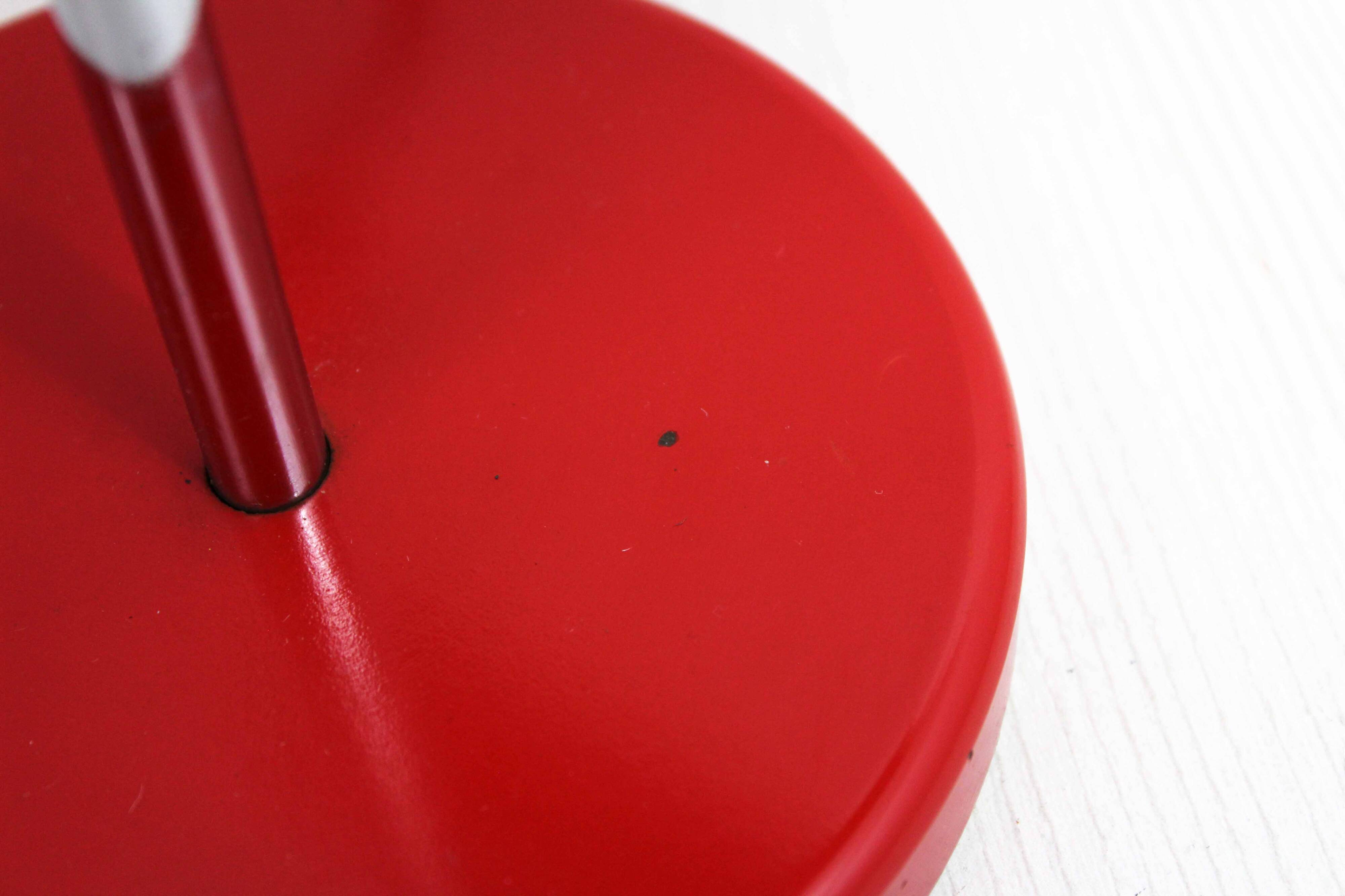 Red metal articulated desk lamp