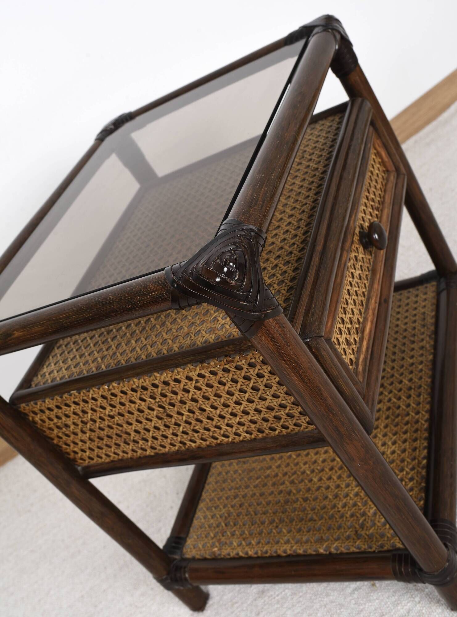 Rattan and cane bedside table, smoked glass top