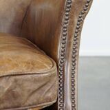 Nice, subtle cowhide armchair with a reversible kilim seat cushion