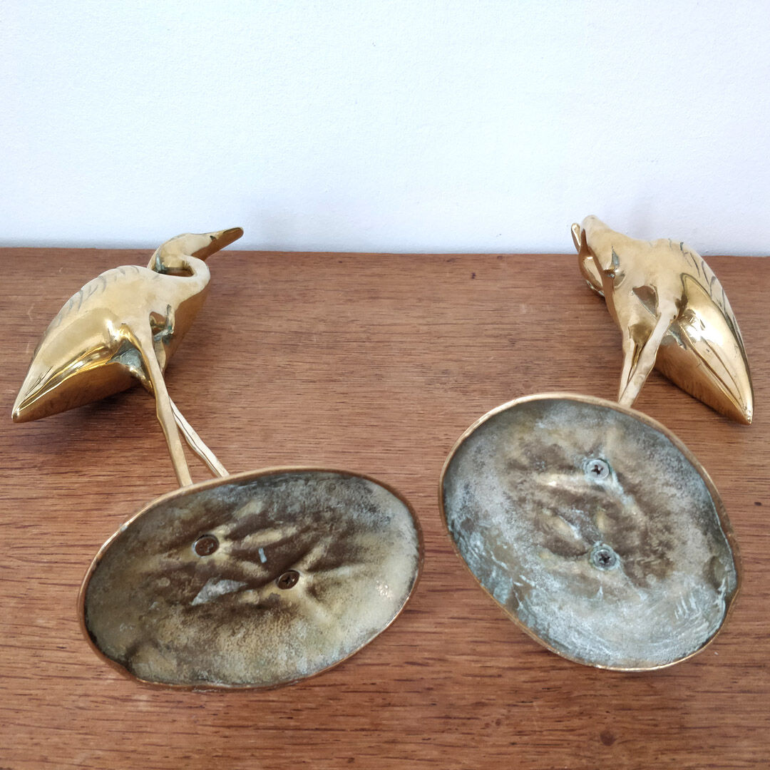 Couple large herons in polished golden brass