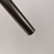 Two cylinder-shaped hanging lamps in black lacquer
