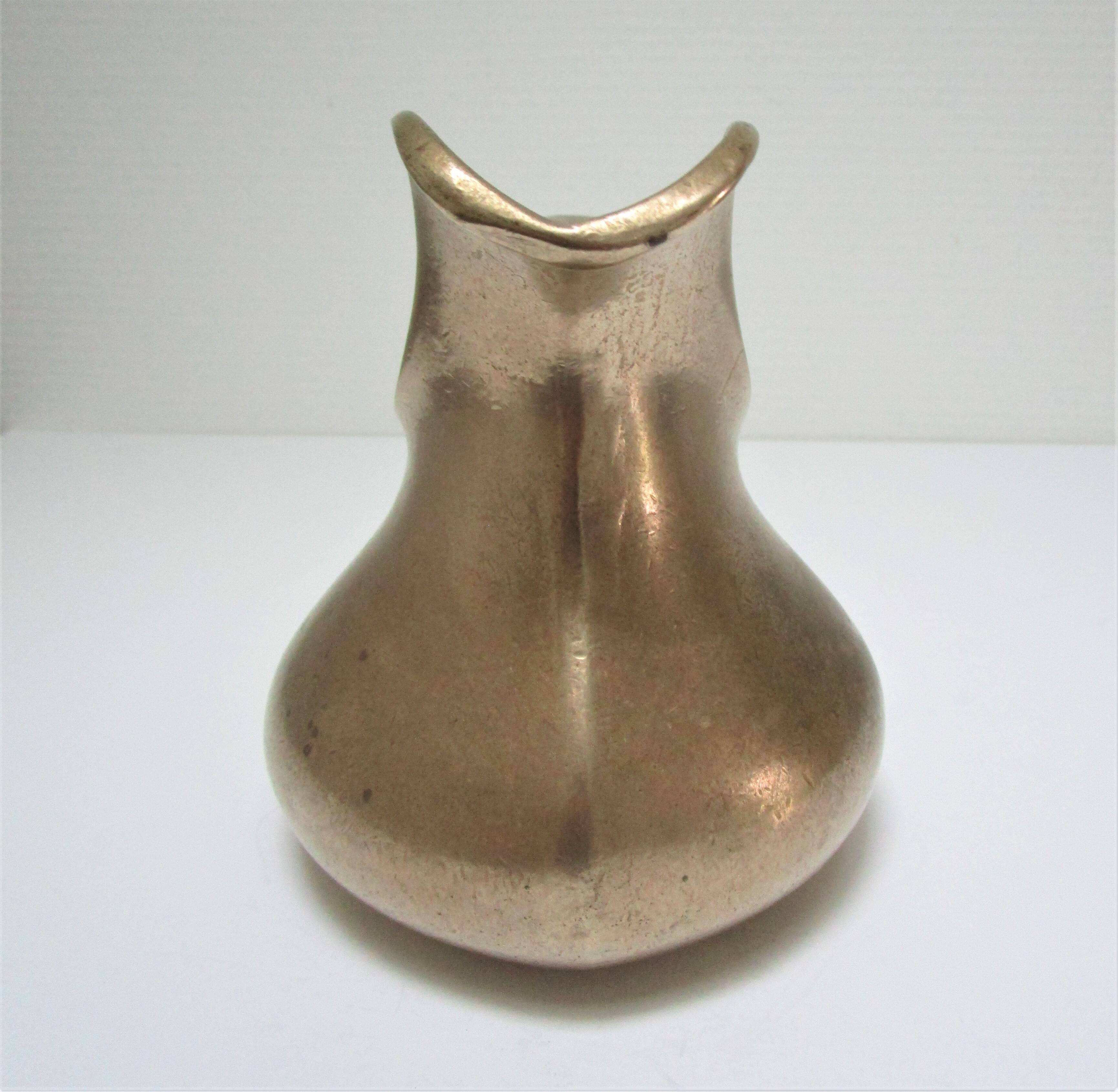 Stylized sculptural solid brass vase with handle