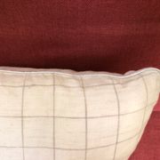 Beige linen cushion with checkered pattern and shiny silver piping