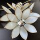 Pair of Hollywood Regency flower sconces in white glass and brass. Italy