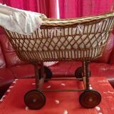 Vintage wicker cradle on wheels from the 1970s.
