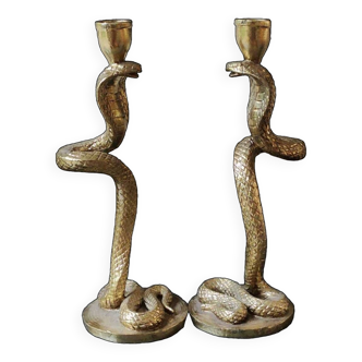 Pair of Flambeau Candlesticks, depicting Royal Cobras. In golden patina resin. High 29 cm