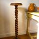 Antique pedestal table with a twisted column.