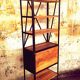 Industrial shelf made of solid exotic mango wood with riveted metal.