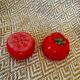 Vintage earthenware set – tomato salt and pepper shakers.
