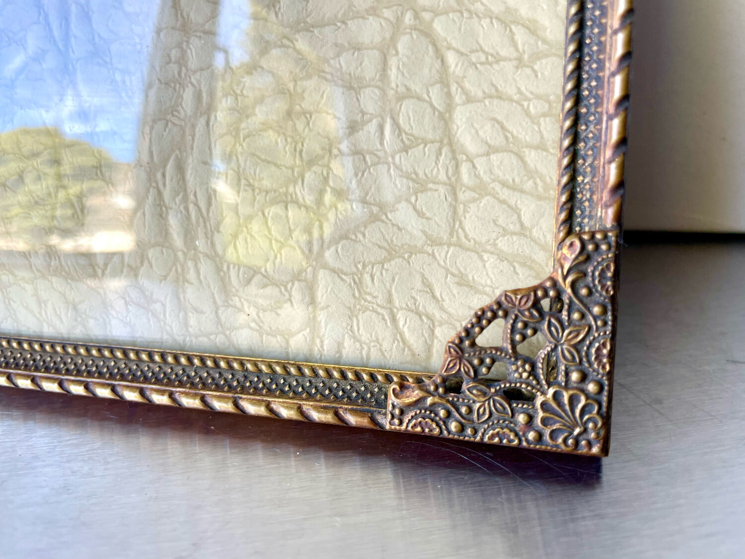Metal frame in gold colored brass