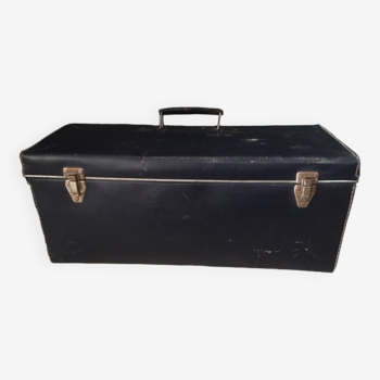 Old blue parallelepiped suitcase