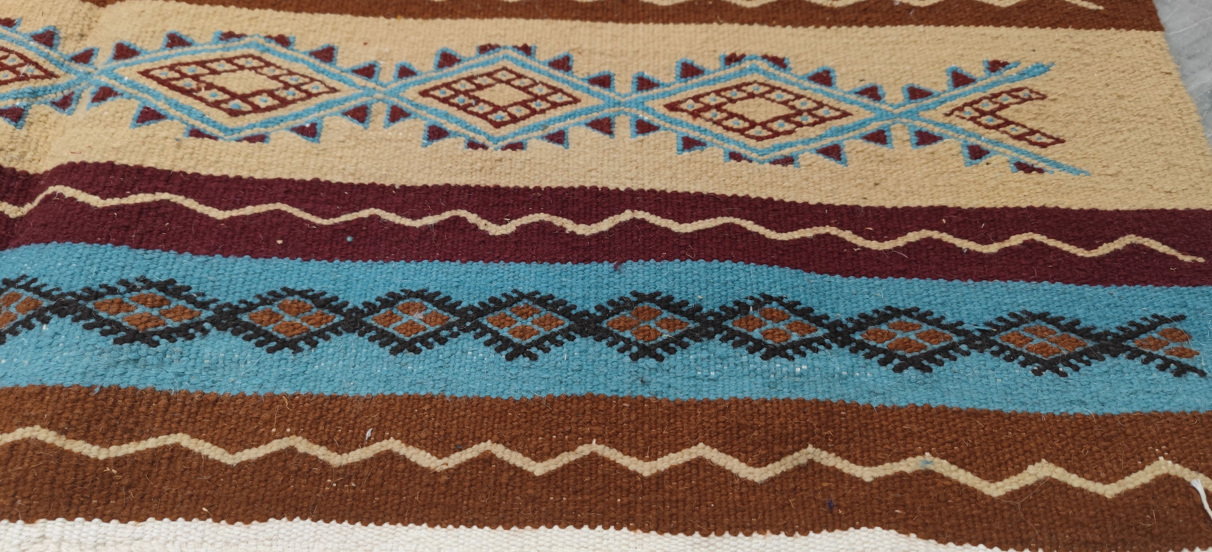 Multicolored hand-woven Berber rugs in natural wool