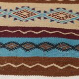 Multicolored hand-woven Berber rugs in natural wool
