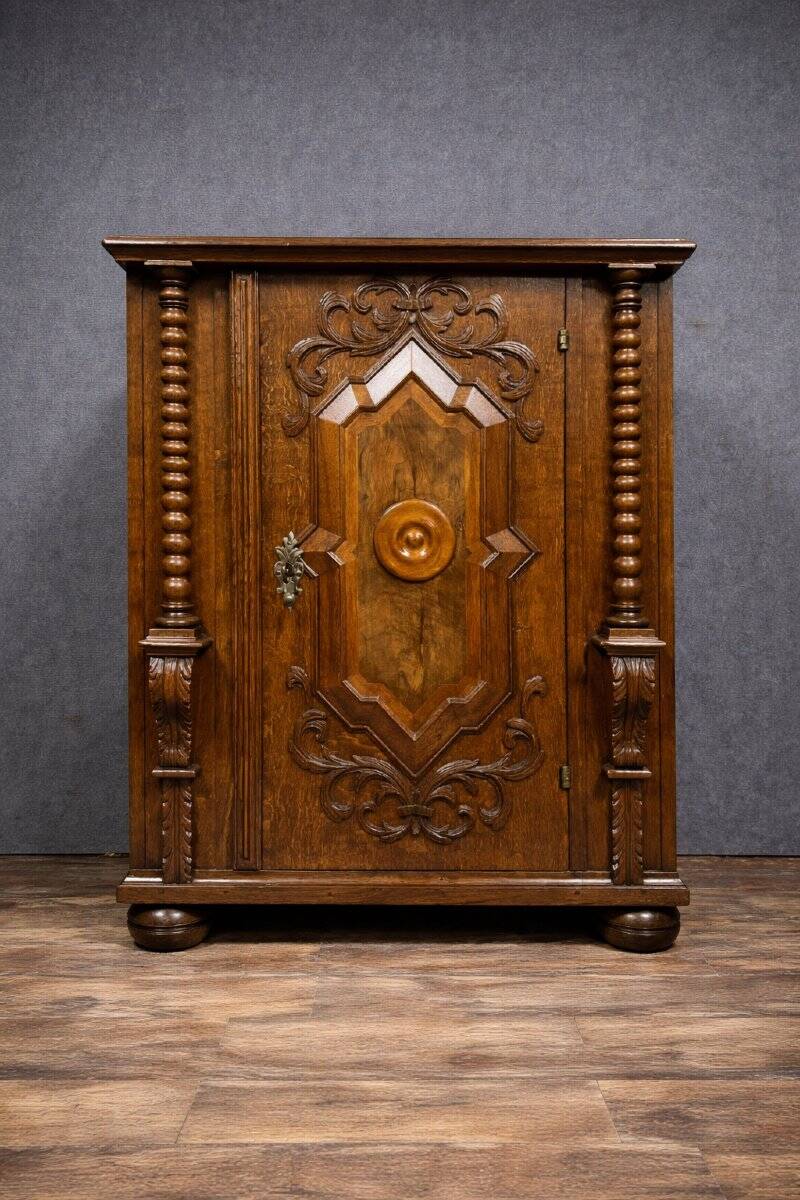 Ornamental piece of solid wood furniture, richly carved, dating from the 17th century.