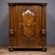 Ornamental piece of solid wood furniture, richly carved, dating from the 17th century.