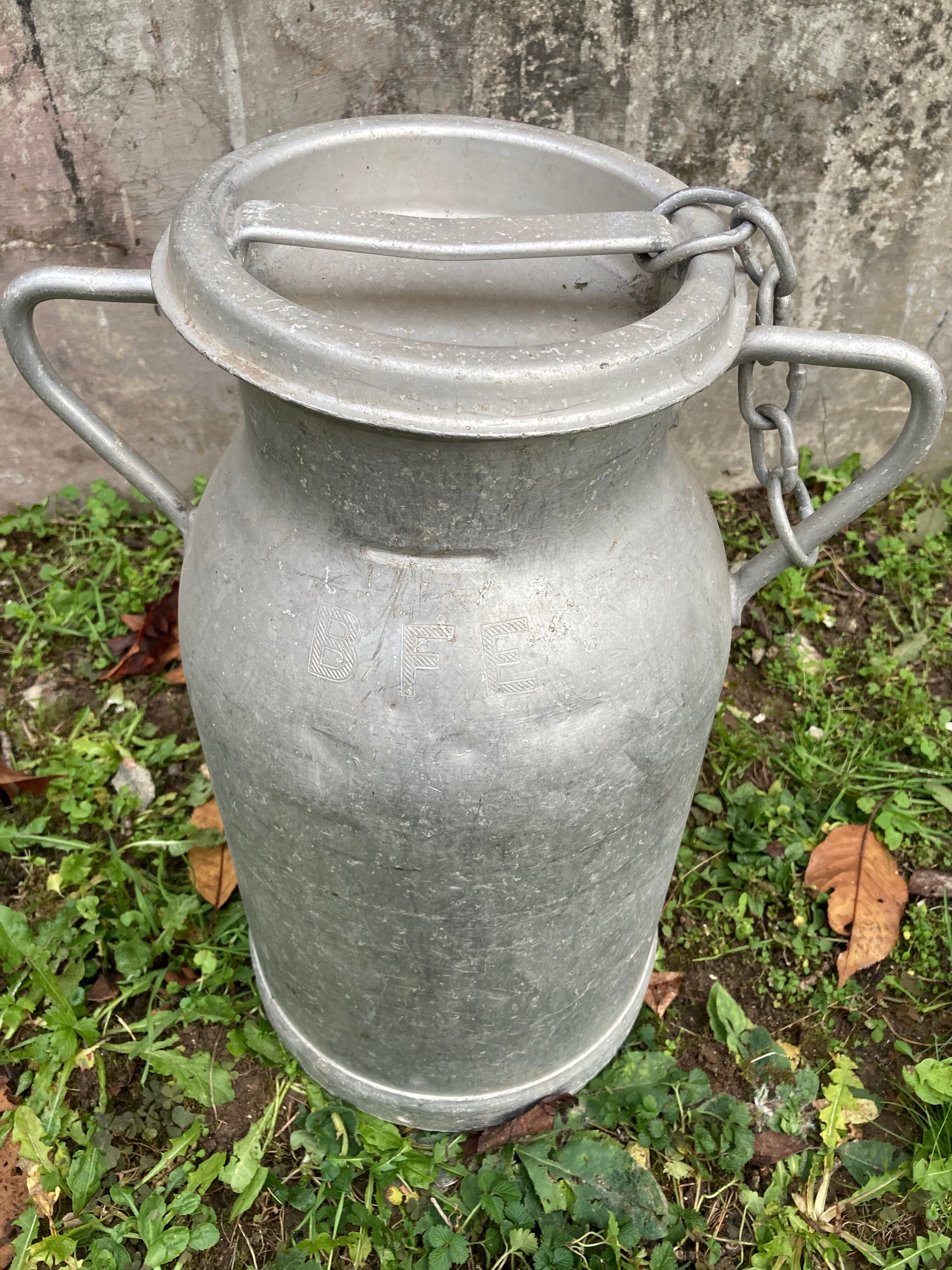 Pair of farm milk jars aluminum cans