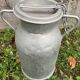Pair of farm milk jars aluminum cans