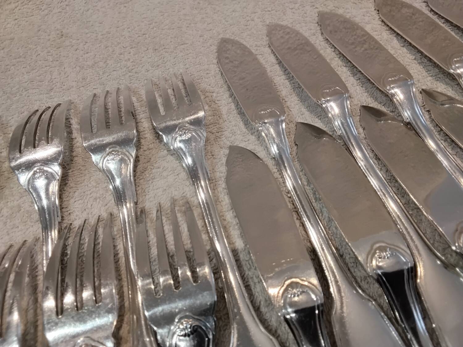 11 silver-plated fish forks and 11 fish knives by Christofle Vendome