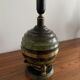 Art Deco table lamp in patinated bronze with eagles holding a globe, France 1940.
