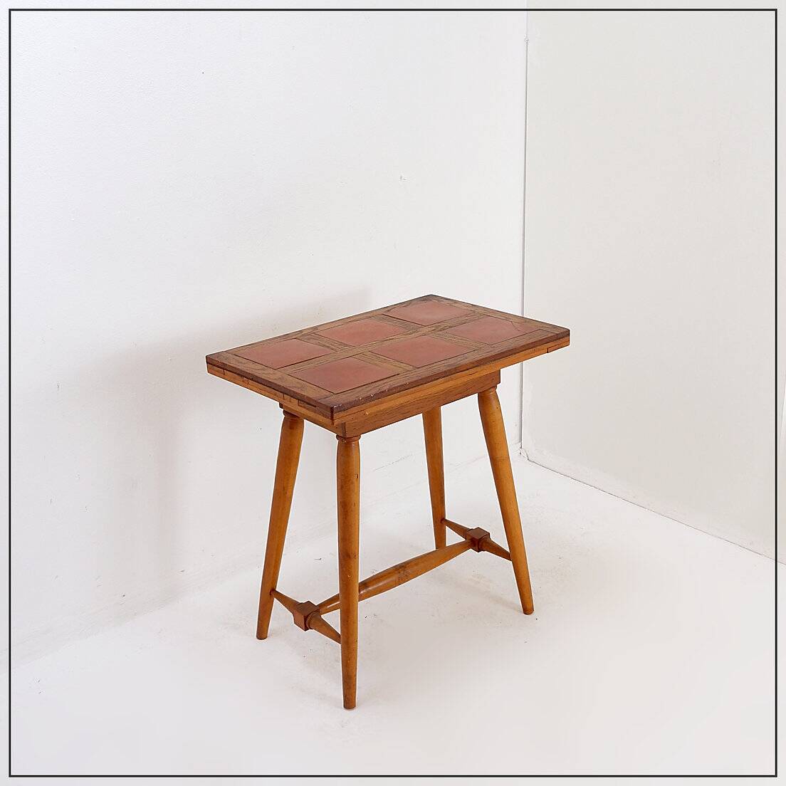 Vintage wooden side table with terracotta top