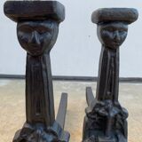 Pair of cast iron chenets with stylized faces High Epoch SEVENTEENTH century