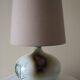 Glazed ceramic ball lamp signed Bossis with a fabric shade.