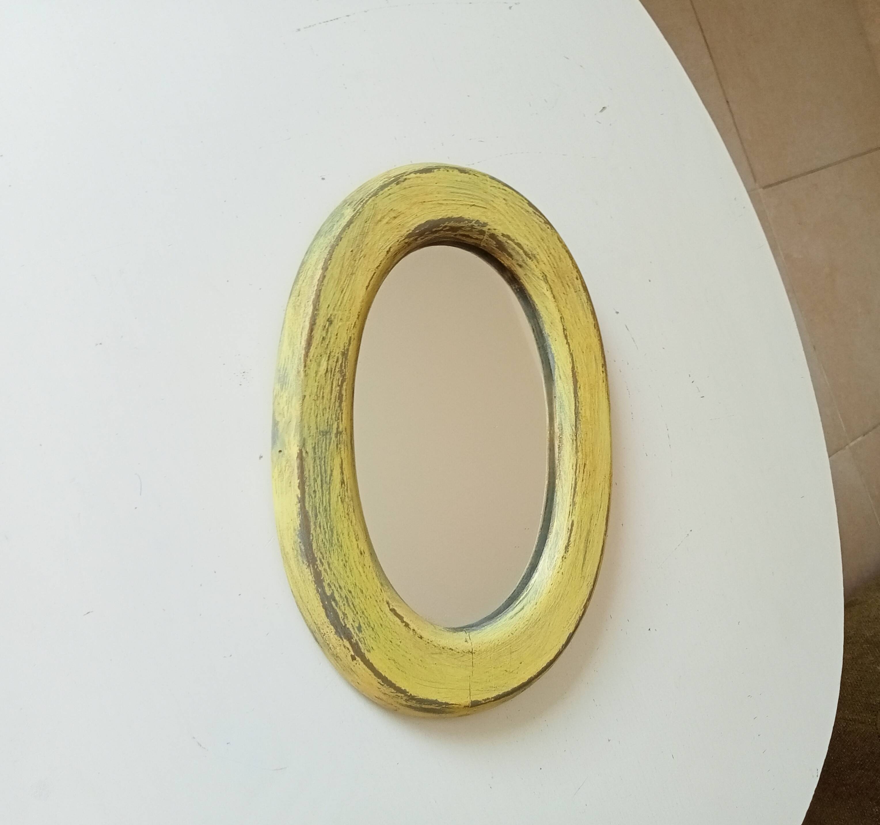 Small antique oval mirror