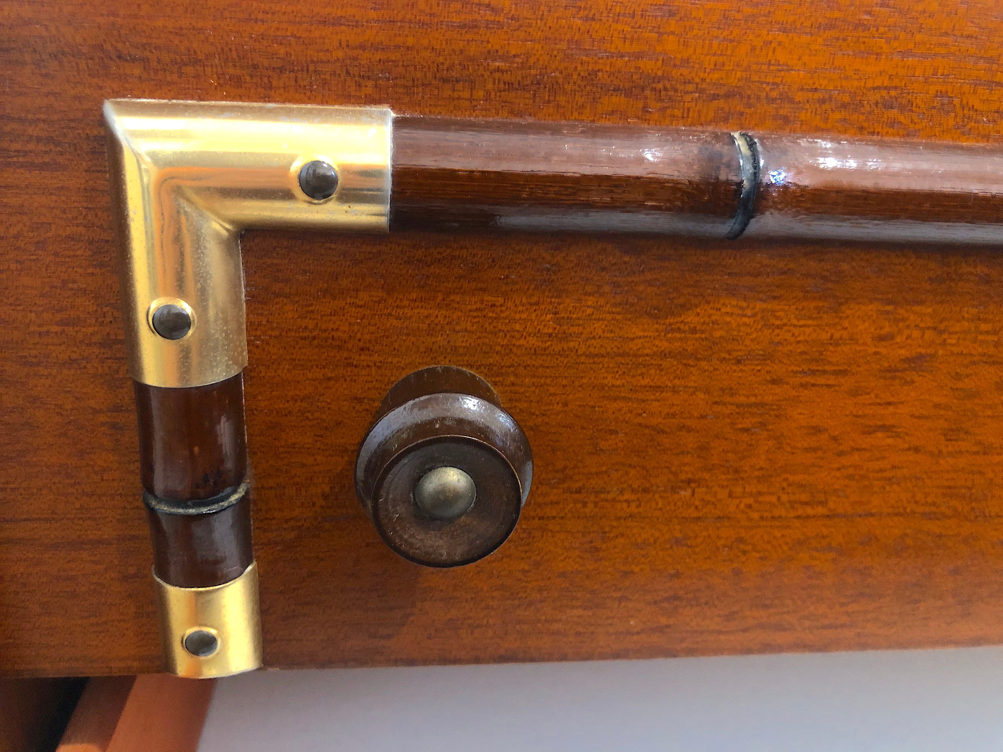 Vintage wooden and gilded chest of drawers colonial style
