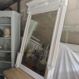 Antique bevelled mirror, frame in pearl grey patinated wood.