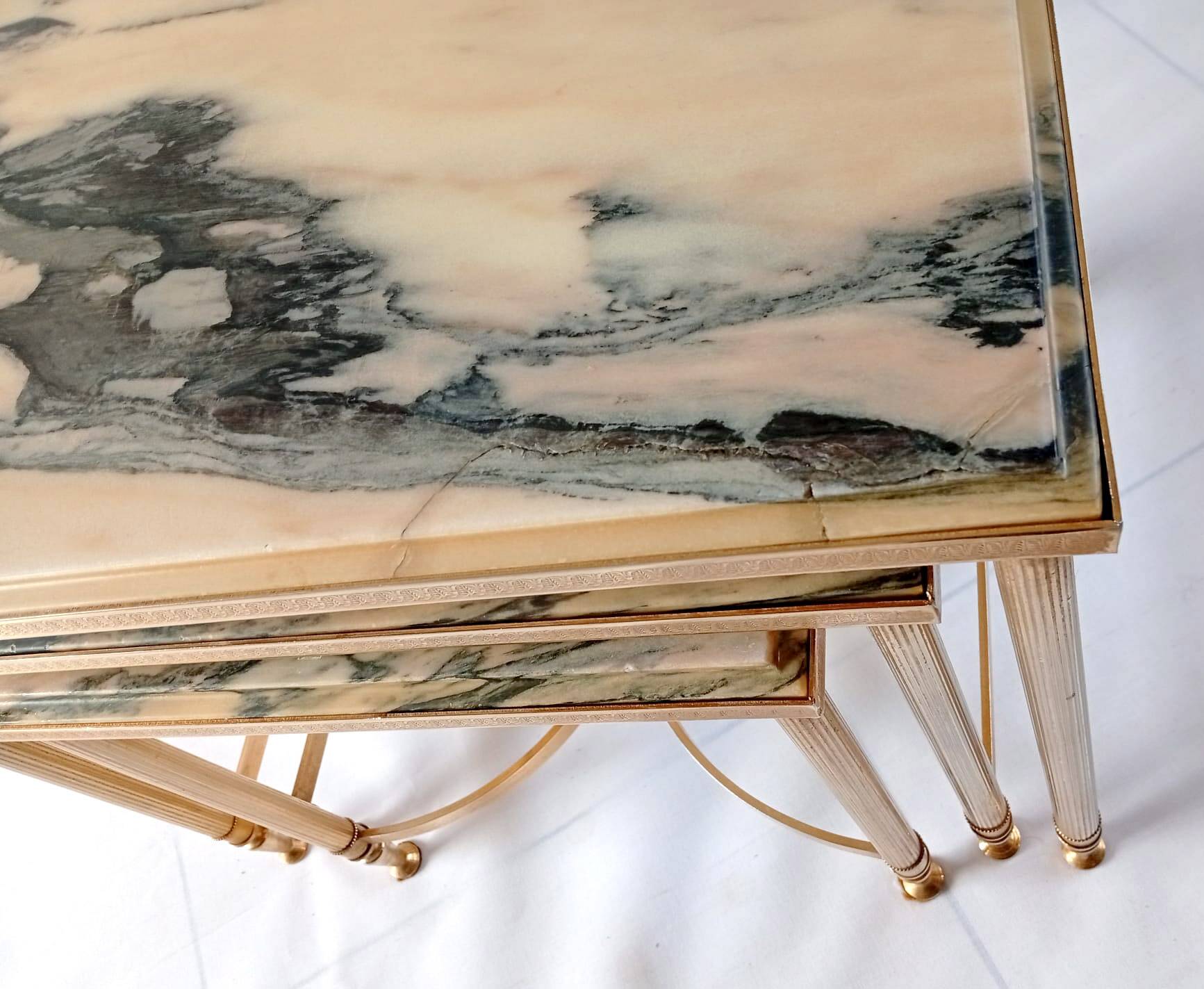 Nested tables in brass and marble.