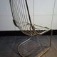Tubular metal chair covered with gilding