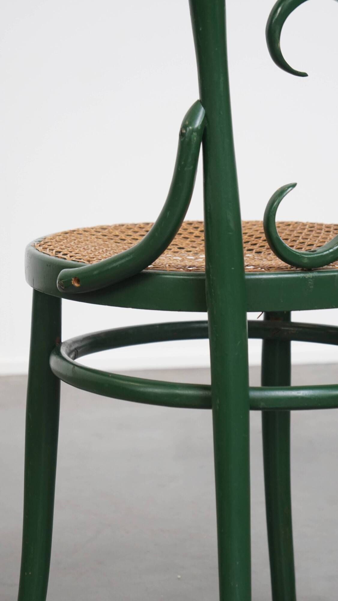 Vintage green bistro chair with woven reed seat