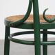 Vintage green bistro chair with woven reed seat