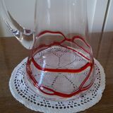 Glass decanter with red glass nets